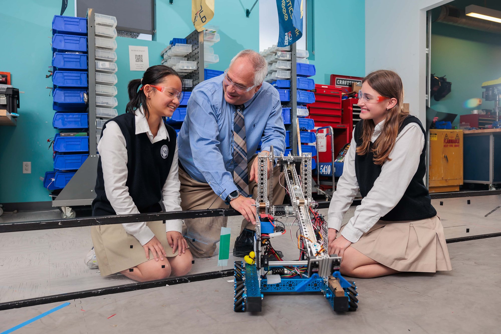 Students working with teacher